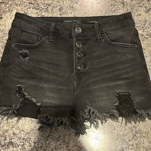 small black ripped shorts